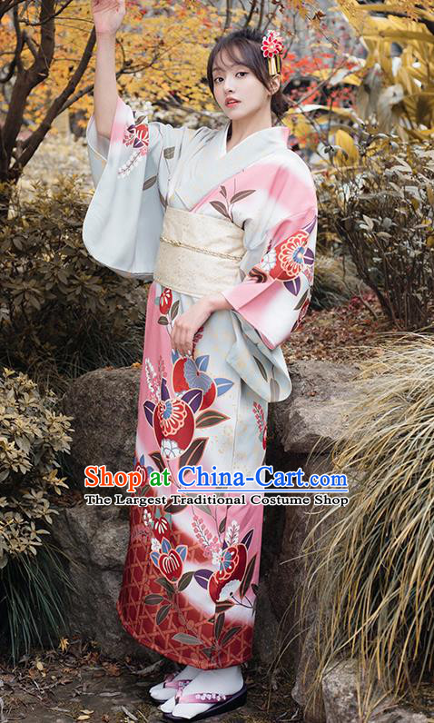 Beautiful 19-year-old Japanese girl wearing traditional furisode